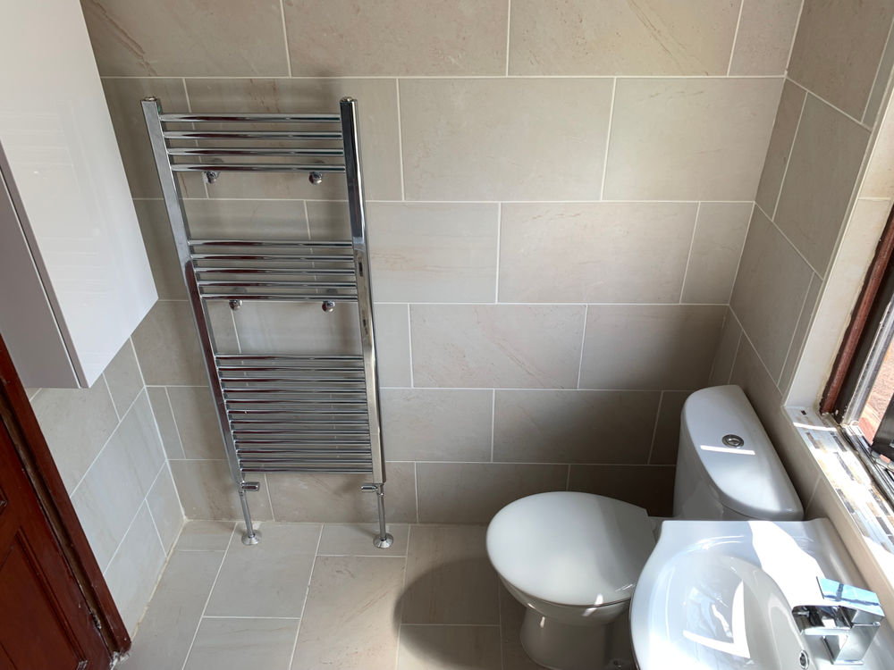 Completed bathroom including toilet and shower area